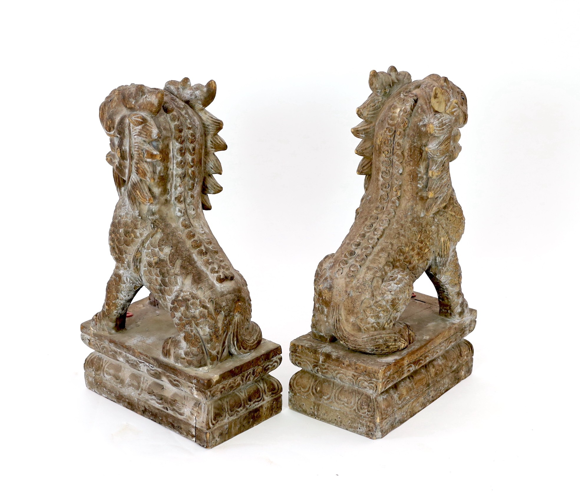 A pair of carved hardwood temple lions, height 69cm